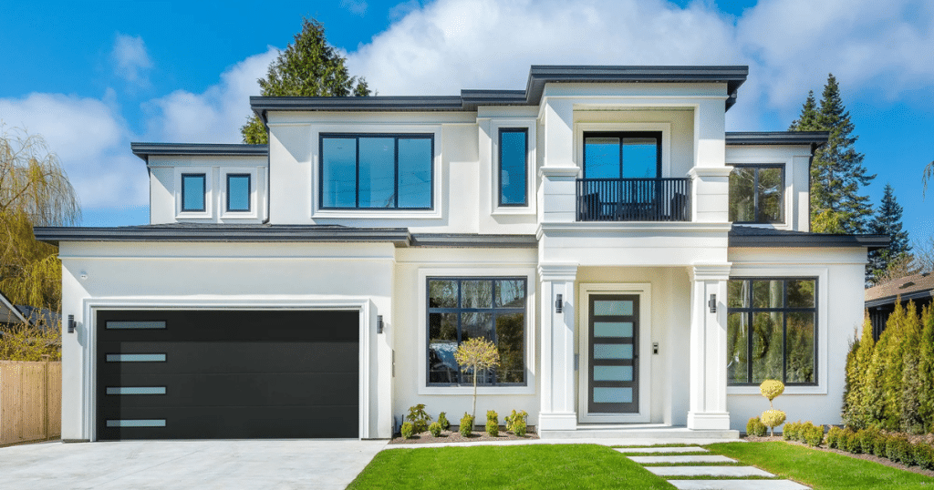 white house with black garage door