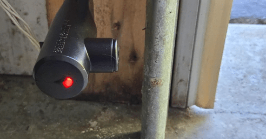 red garage door sensor light